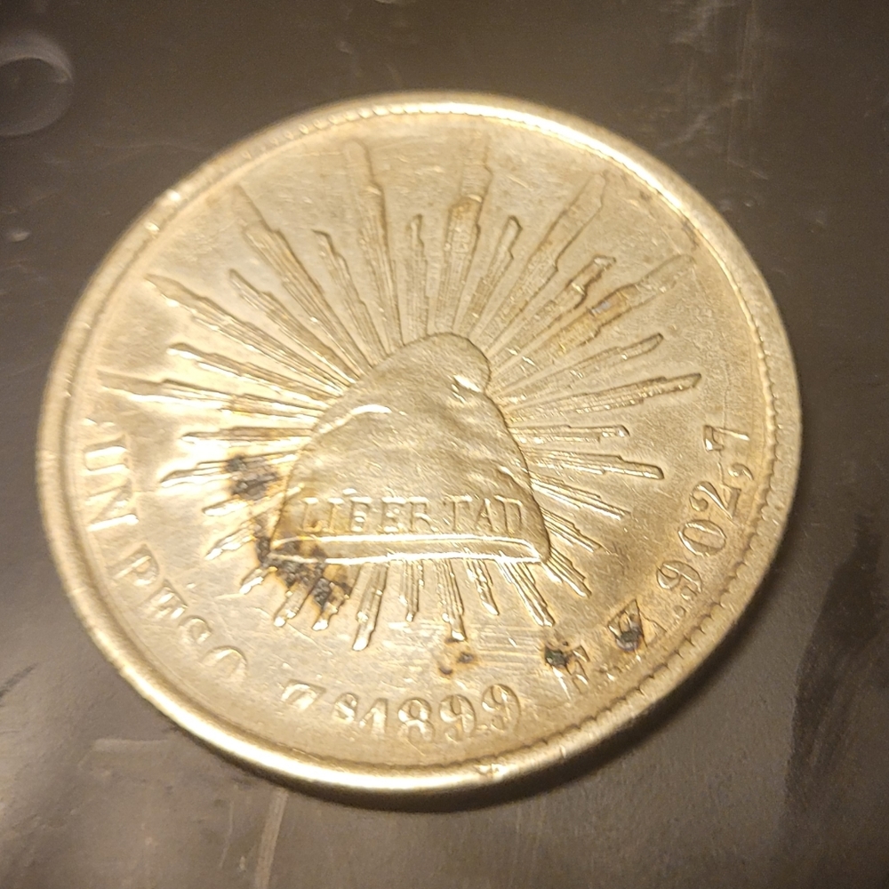 1899 silver Mexico Un peso coin